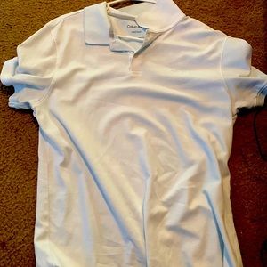 Calvin Klein white polo with a lint blue tint